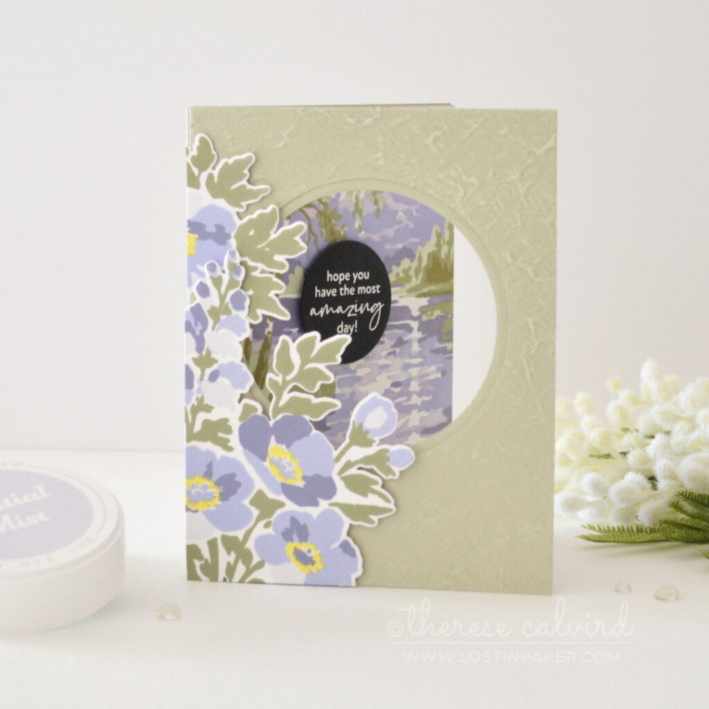 Sage green and purple floral trifold card with an embossed front, circle window, bold sentiment and soft stenciled landscape scene.