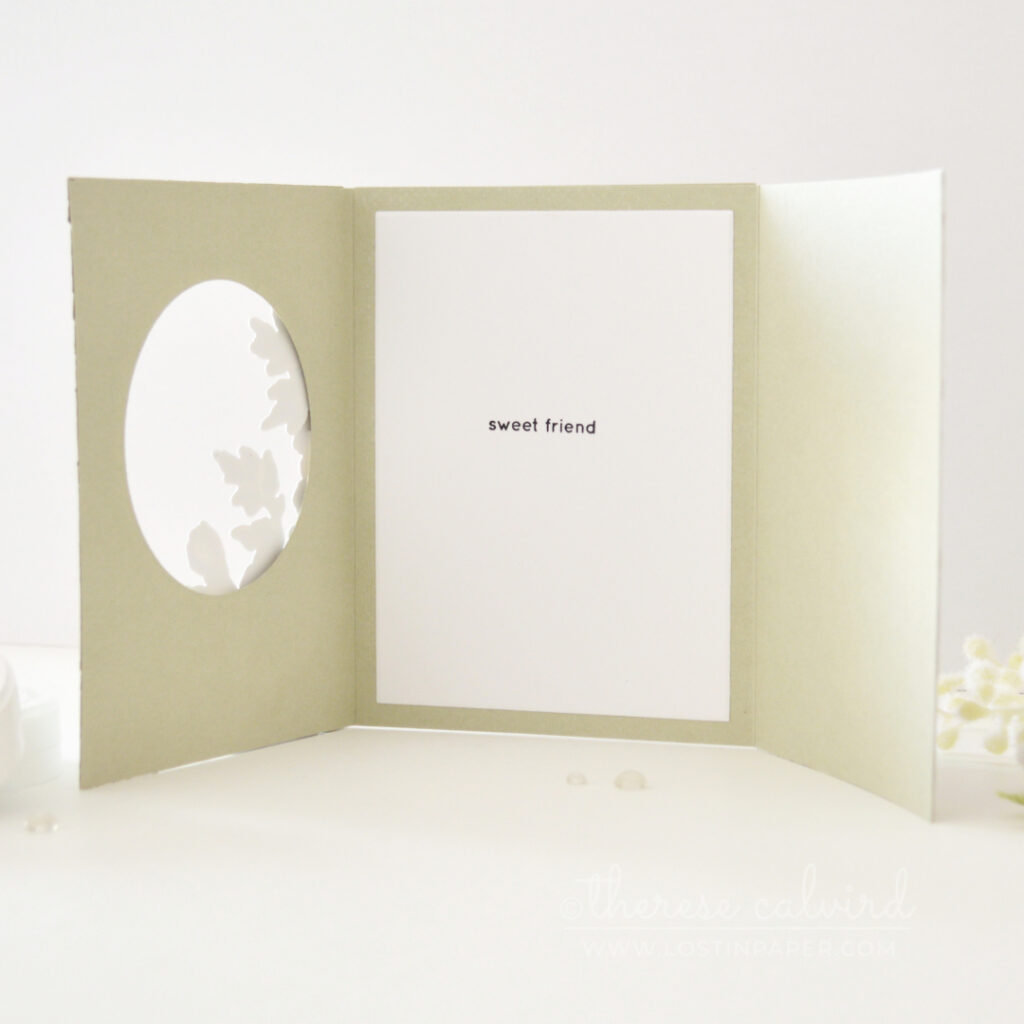 Sage green and purple floral trifold card with an embossed front, circle window, bold sentiment and soft stenciled landscape scene.