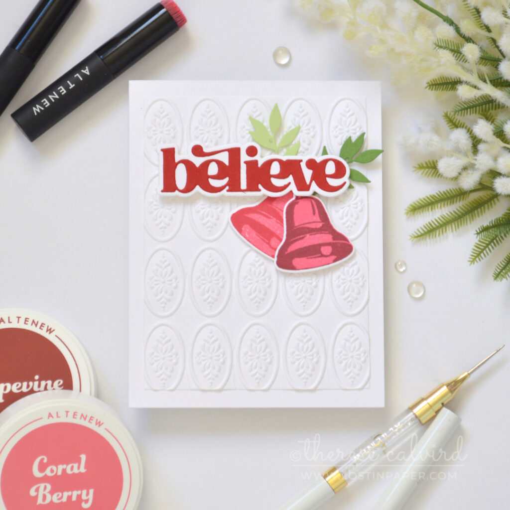 Christmas card with a dimensional embossed background and poinsettia focal image.
