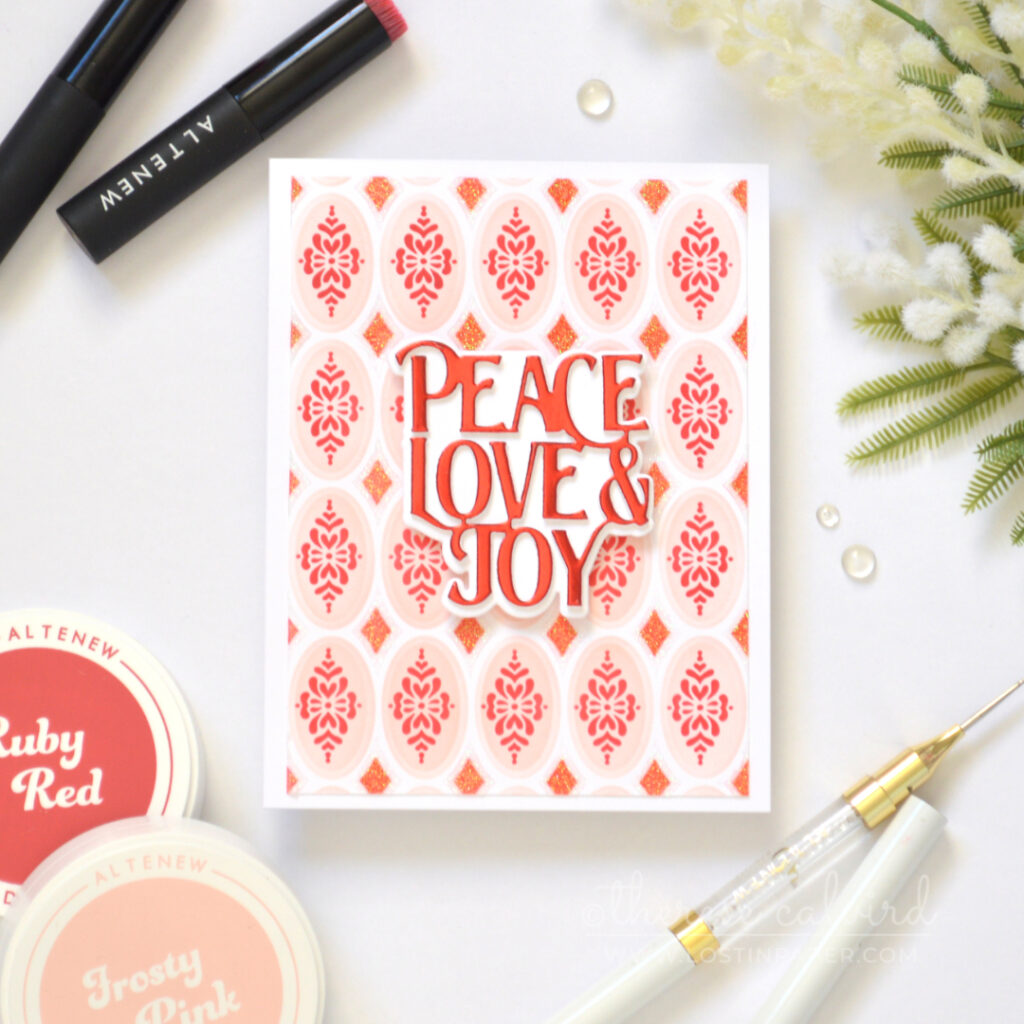 Christmas card featuring a colorful stencilled background with raised texture paste.