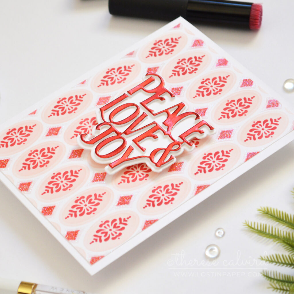Christmas card featuring a colorful stencilled background with raised texture paste.