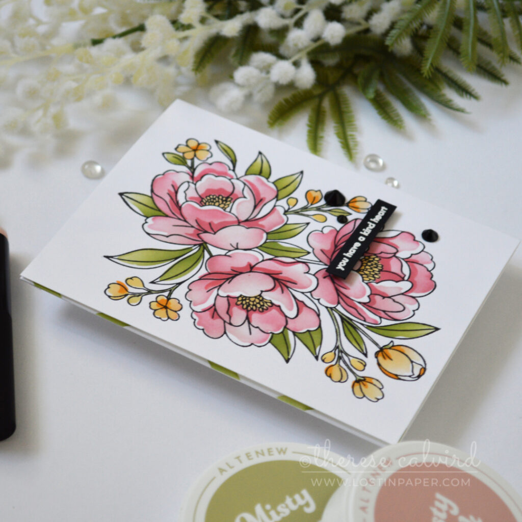 Handmade floral card with a dusty pink BetterPress bouquet, soft green and yellow stenciling, a green diamond pattern, torn paper edge, and a kind sentiment.