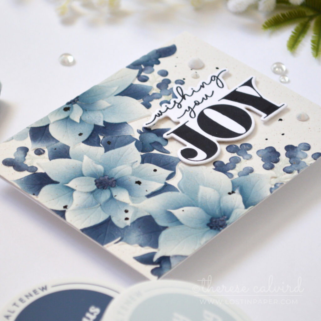 Monochromatic blue-grey poinsettia Christmas card.