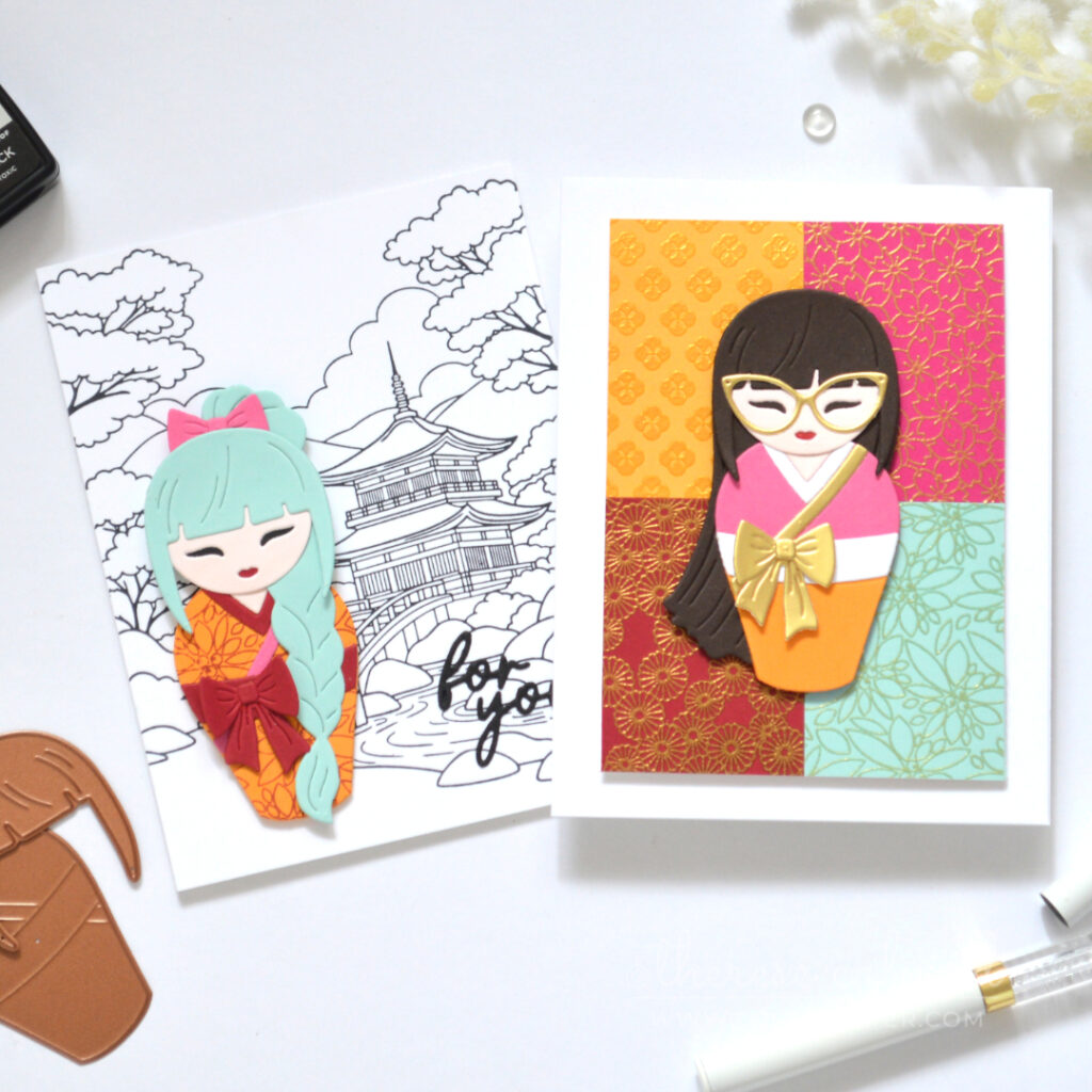 Two handmade cards with colourful die cut Kokeshi girls and contrasting backgrounds.